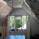 <p>Foil backed insulation being fitted.</p>