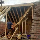 <p>Old hip roof removed and the new rafters are going in.</p>