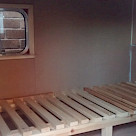 <p>Slatted bed in a mini caravan called a pod.</p>